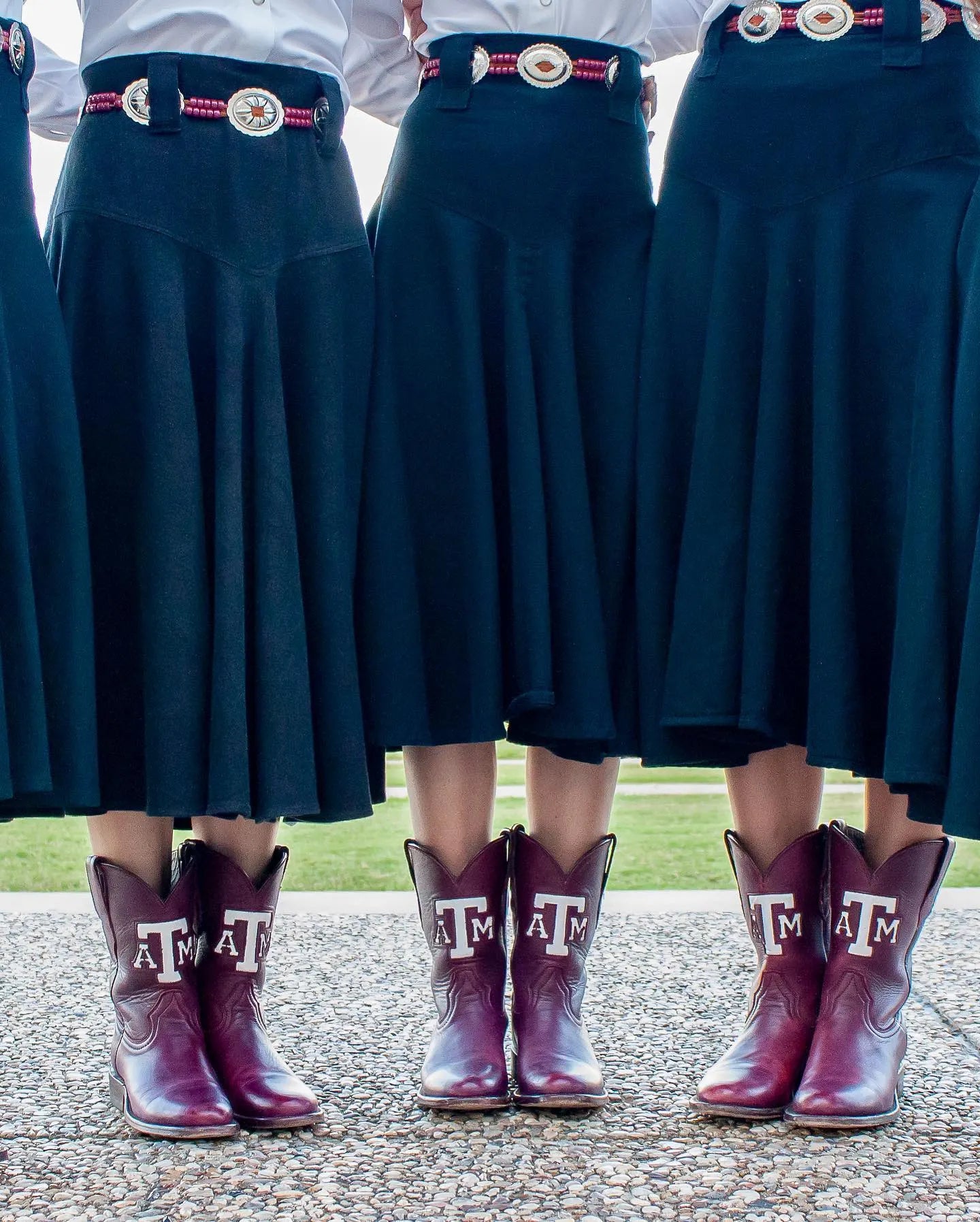 Group wearing coordinated maroon Texas A&M boots with navy skirts